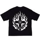The Cleo Flame Black Tee features a large white graphic of a stylized flower surrounded by flame shapes on the back, and is crafted from premium materials in a cut-and-sew construction for superior comfort and quality.