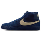 The Coastal Blue Pale Yellow IO0667400 Blazer Mid Nike SB Suede Skateboarding Shoes feature navy blue suede, a pale yellow Swoosh, white NIKE heel text, responsive cushioning, blue laces, and a matching blue sole for skateboarders.