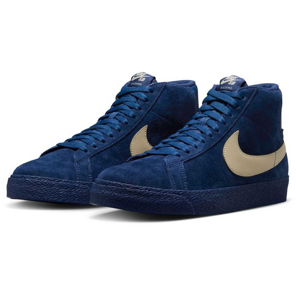 The Nike SB Blazer Mid Coastal Blue Pale Yellow IO0667400 skateboarding shoes feature deep blue suede, pale yellow swooshes, coordinating laces and sole, plus responsive cushioning for all-day comfort and signature style.