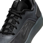 Close-up of the Cool Grey White FQ1273003 Zoom Nyjah 4 Nike SB Skateboarding Shoe, featuring a reinforced mesh upper, black laces, a glossy black Nike swoosh on the side, and a sleek, modern design with a dark, thick sole.