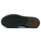 The image shows the sole of the Cool Grey White FQ1273003 Zoom Nyjah 4 Nike SB Skateboarding Shoe, featuring a wavy tread pattern, HART outsole, red Nike Swoosh near the heel, and a mainly black translucent sole.