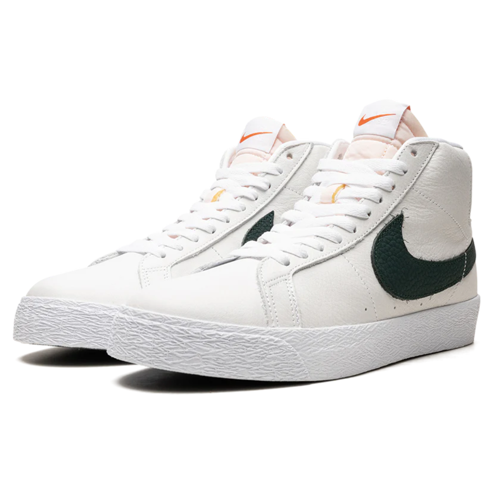 The DR9092100 White Pro Green Blazer Mid Nike SB leather skateboarding shoes feature white leather, green swooshes, white laces, and textured rubber soles—versatile high-tops displayed against a plain white background.