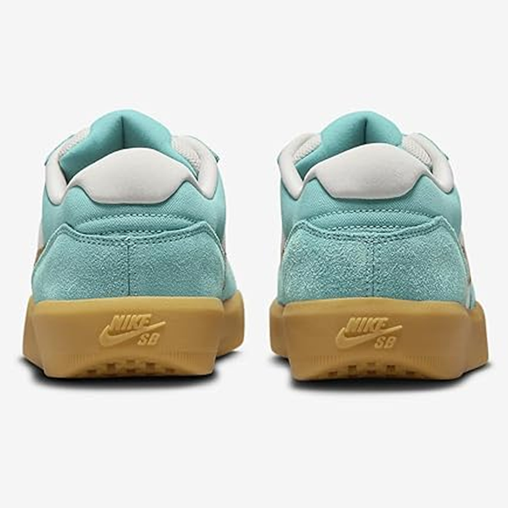 A pair of Nike SB Force 58 sneakers in Green Frost/Dark Russet suede with gum soles, shown from the back. The Nike SB logo is visible on the heels of these stylish skate shoes. Product: DV5477-302.