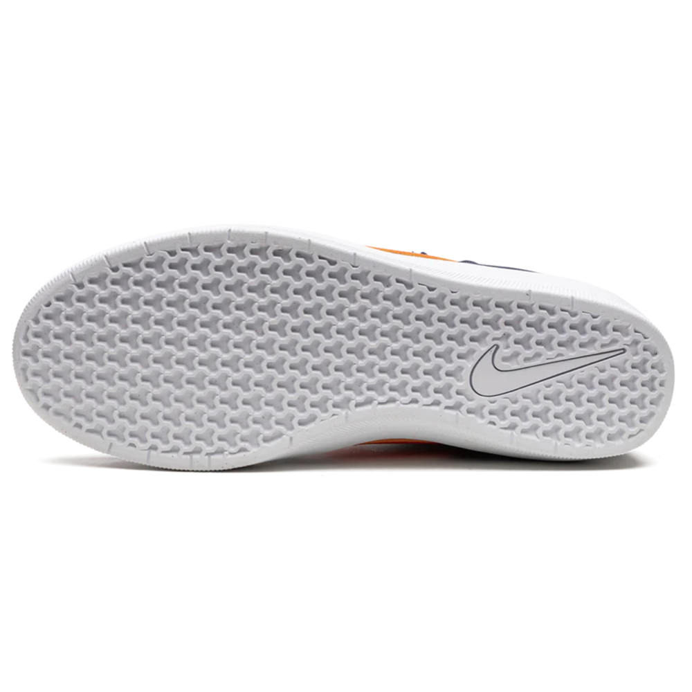 The image displays the white, textured sole of the DV5477400 Midnight Navy Safety Orange Force 58 Nike SB Suede Shoe, featuring a honeycomb pattern and a Nike swoosh logo near the heel.