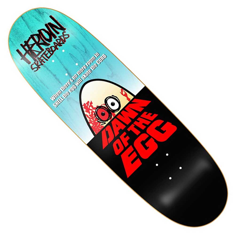 The Dawn of the Egg 9.4x32 Heroin Skateboards Deck features a cartoon cracked egg with wide eyes and a red crack above bold "DAWN OF THE EGG." Made from Hard Rock Maple, it has graffiti-style HEROIN SKATEBOARDS text on top.