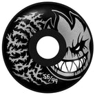 The Deathmask II Radial Full Black 56mm99A Formula Four Spitfire Wheel features a large grinning cartoon face on the right, silver flame-like patterns on the left, and "56/99" printed near the bottom center.