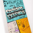 The Delfino Scribble FeelBase Pro 8.25in x 31.00in deck from Santa Cruz Skateboards features graffiti-style "FABULOUS DEFENSE" and "SANTA CRUZ" text with cartoon art—mouse, bicycle, dice, yellow skull, and vibrant lines inspired by Delfino Scribble.