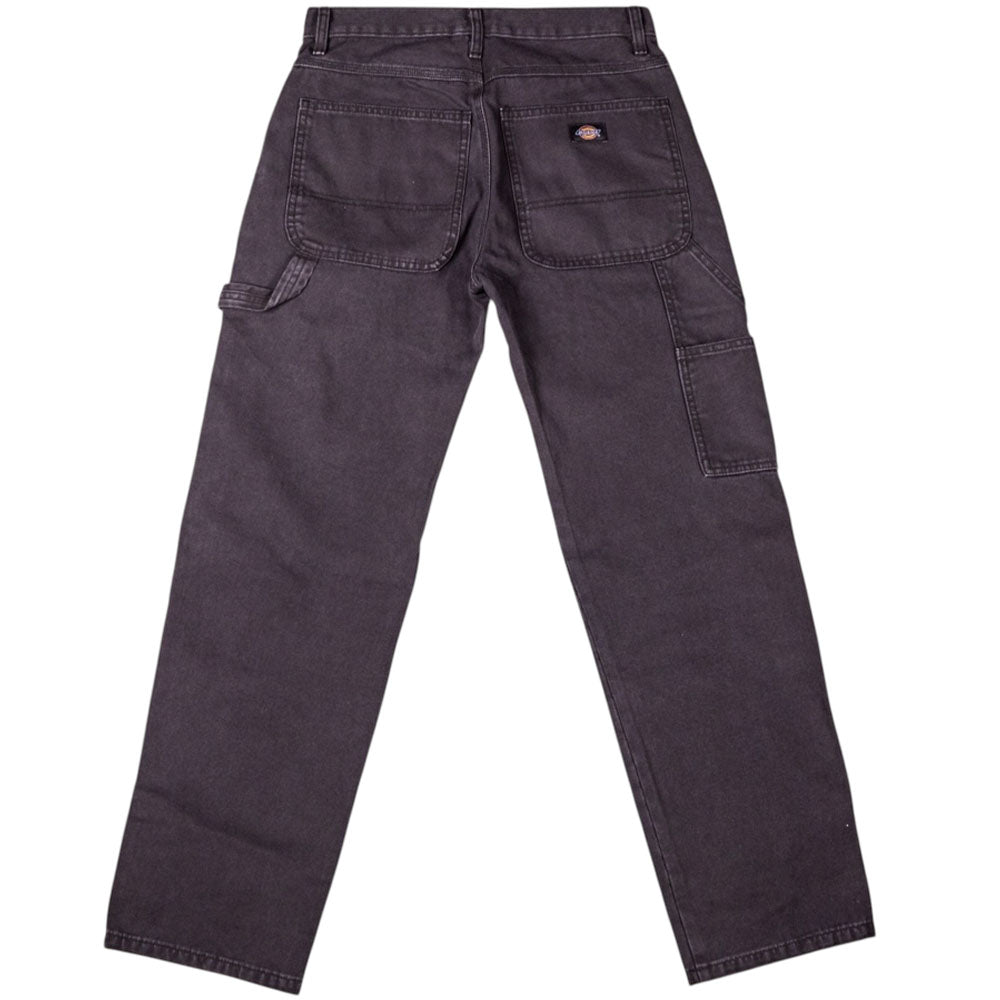 The Worn In Black Relaxed BLK A88NC Carpenter Duck Pant from Dickies Skateboarding is shown from the back, highlighting large rear pockets, a side tool pocket, and a small brand patch on the right pocket.