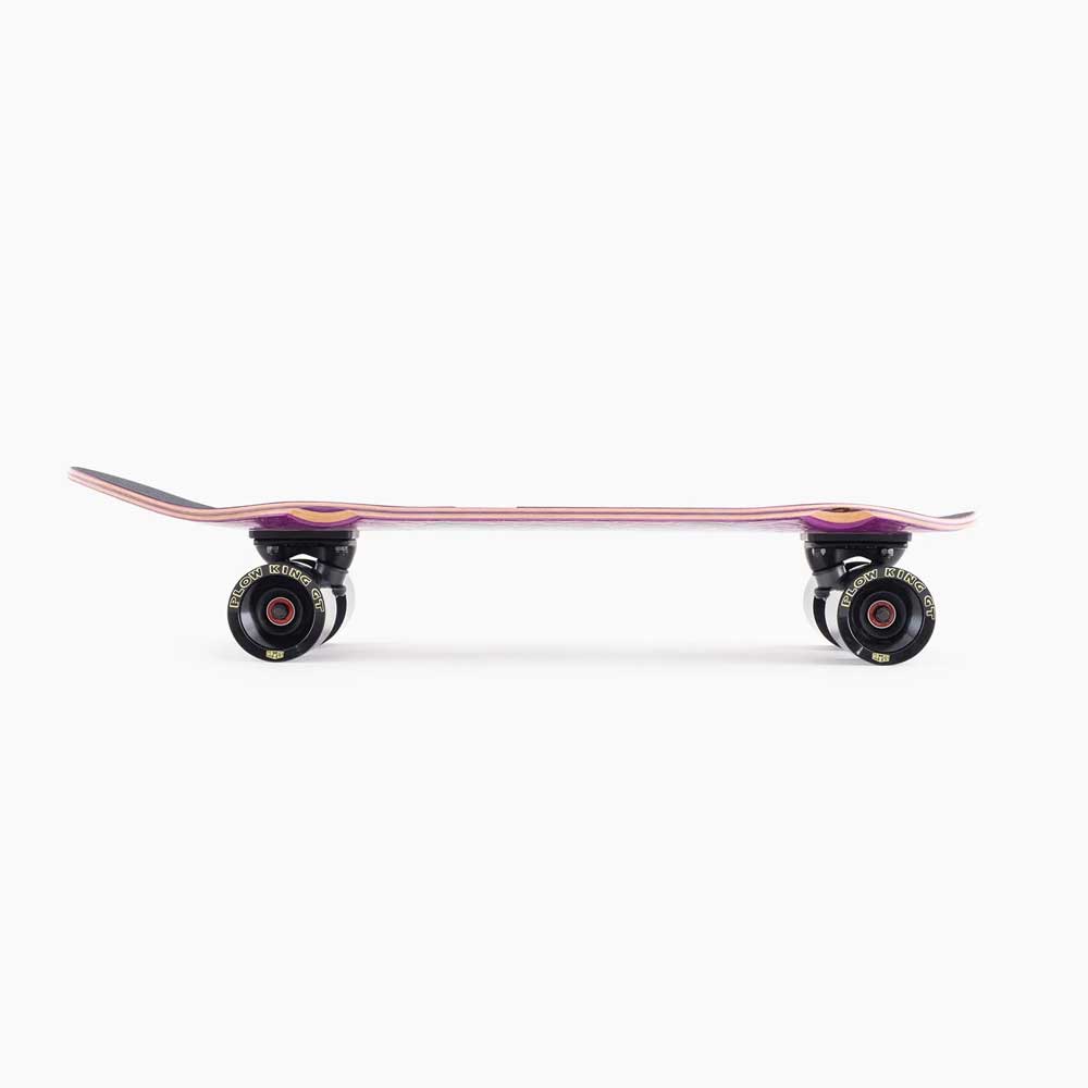 A side view of the Dinghy Classic Fender Moray Eel Landyachtz Complete Skateboard, featuring a pink deck and 74mm black wheels, displayed on a plain white background.
