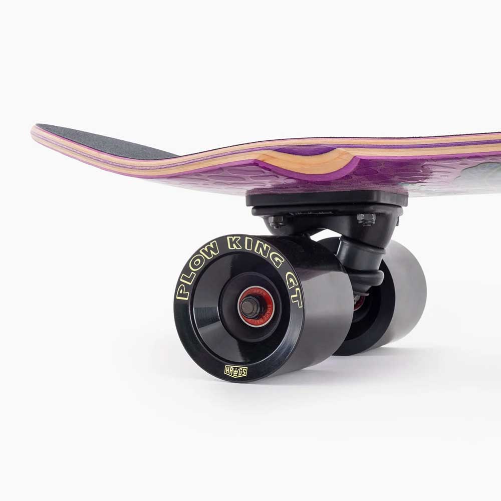Close-up of the Dinghy Classic Fender Moray Eel Landyachtz Complete Skateboard's rear end, featuring a purple deck, black grip tape, and large 74mm Plow King GT wheels on a white background.
