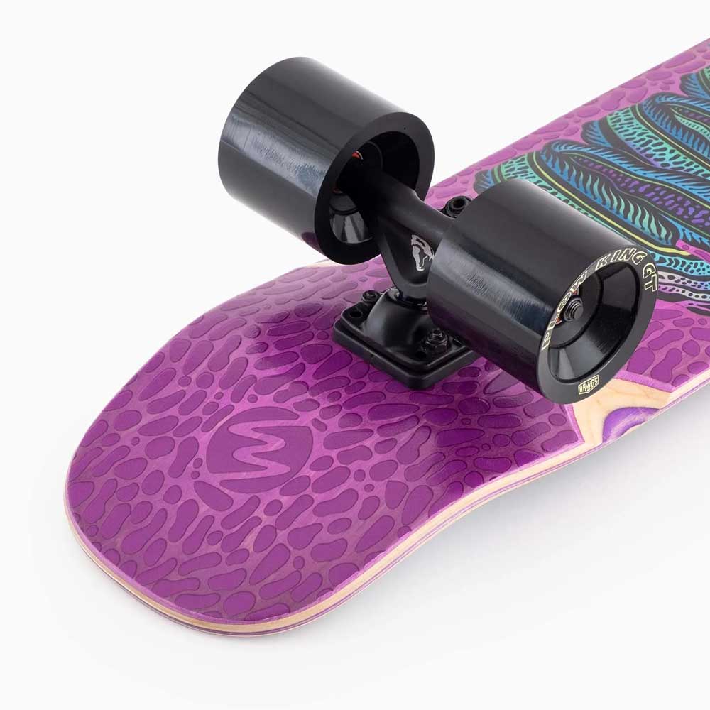 Close-up of the Dinghy Classic Fender Moray Eel Landyachtz Complete Skateboard tail, showcasing a purple patterned deck and large 74mm black wheels on sleek black trucks.