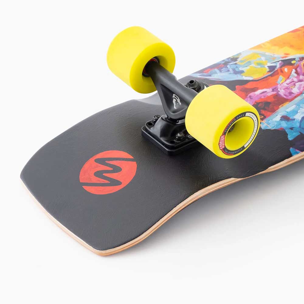 Close-up of the Dinghy Legend Classic Landyachtz Complete Skateboard’s tail, showing bright yellow wheels, black hardware, a black tail with a red circular logo, molded wheel flares, and vibrant artwork along the side of the deck.