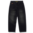Distressed Flat Black Relaxed Denim Jeans by Butter Goods, featuring a slightly faded wash, front pockets, visible seams, and laid flat on a white background.