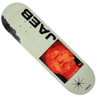 The Dylan Jaeb Window 8.375x31.75 Quasi Skateboards Deck in gray features bold JAC lettering, a red pixelated face, black abstract shape on the left edge, and a small black star at the bottom right.