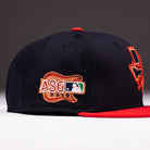 The El Karma ASG Navy Red Houston Astros New Era Hat 5950 Fitted is a classic cap for Astros fans, featuring a navy blue crown with a red brim, a 2019 MLB All-Star Game patch, and part of a Texas outline logo on the side.