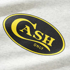 The Emblem Tee Ash Cash Only T-Shirt (COD150201) features a black oval logo with a yellow border and "CASH" in bold yellow letters, "ONLY" beneath, screenprinted on a light gray 6.5oz premium heavyweight cotton tee.