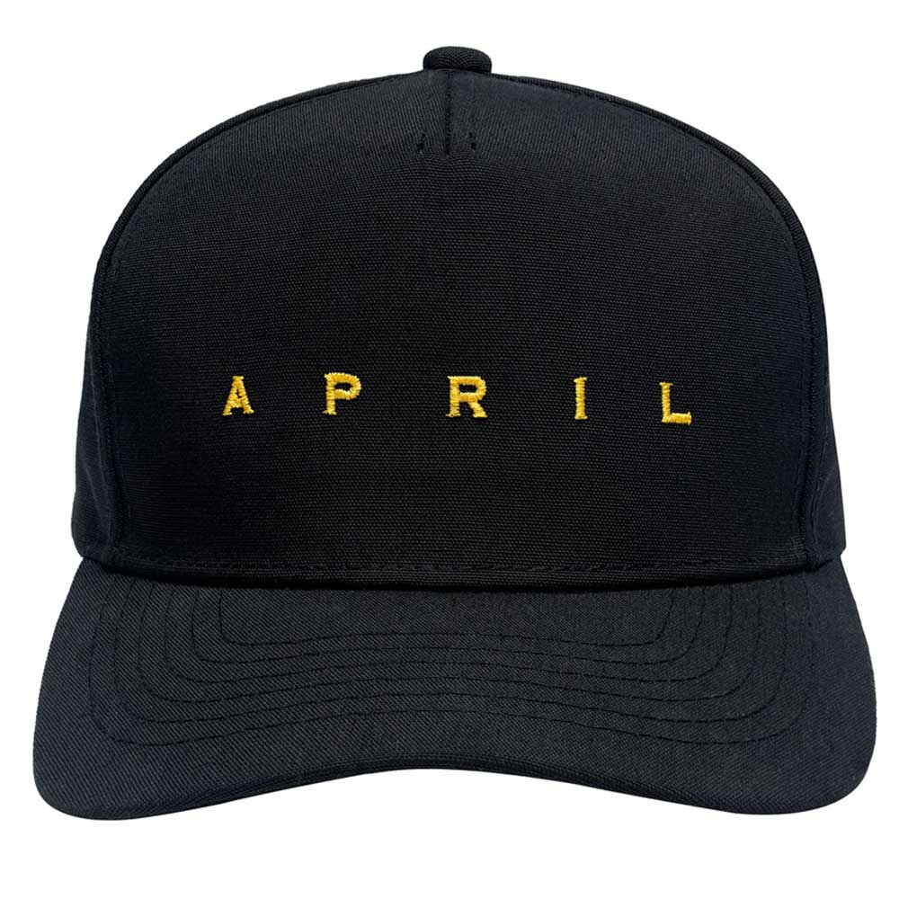 The Embroidered Logo Hat by April Skateboards is an adjustable black cap featuring bold gold "APRIL" lettering across the front.