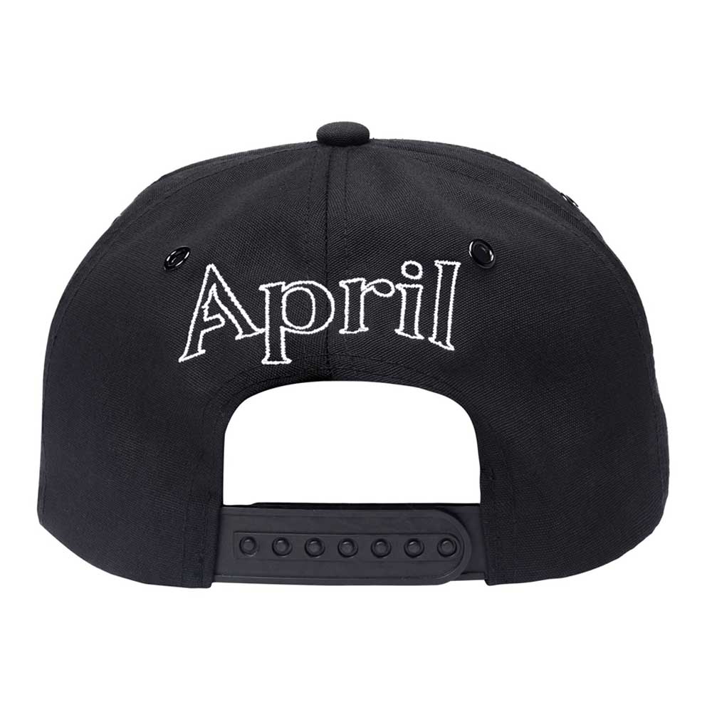 Black Embroidered Logo Hat by April Skateboards, featuring "April" in silver embroidery above an adjustable plastic strap.