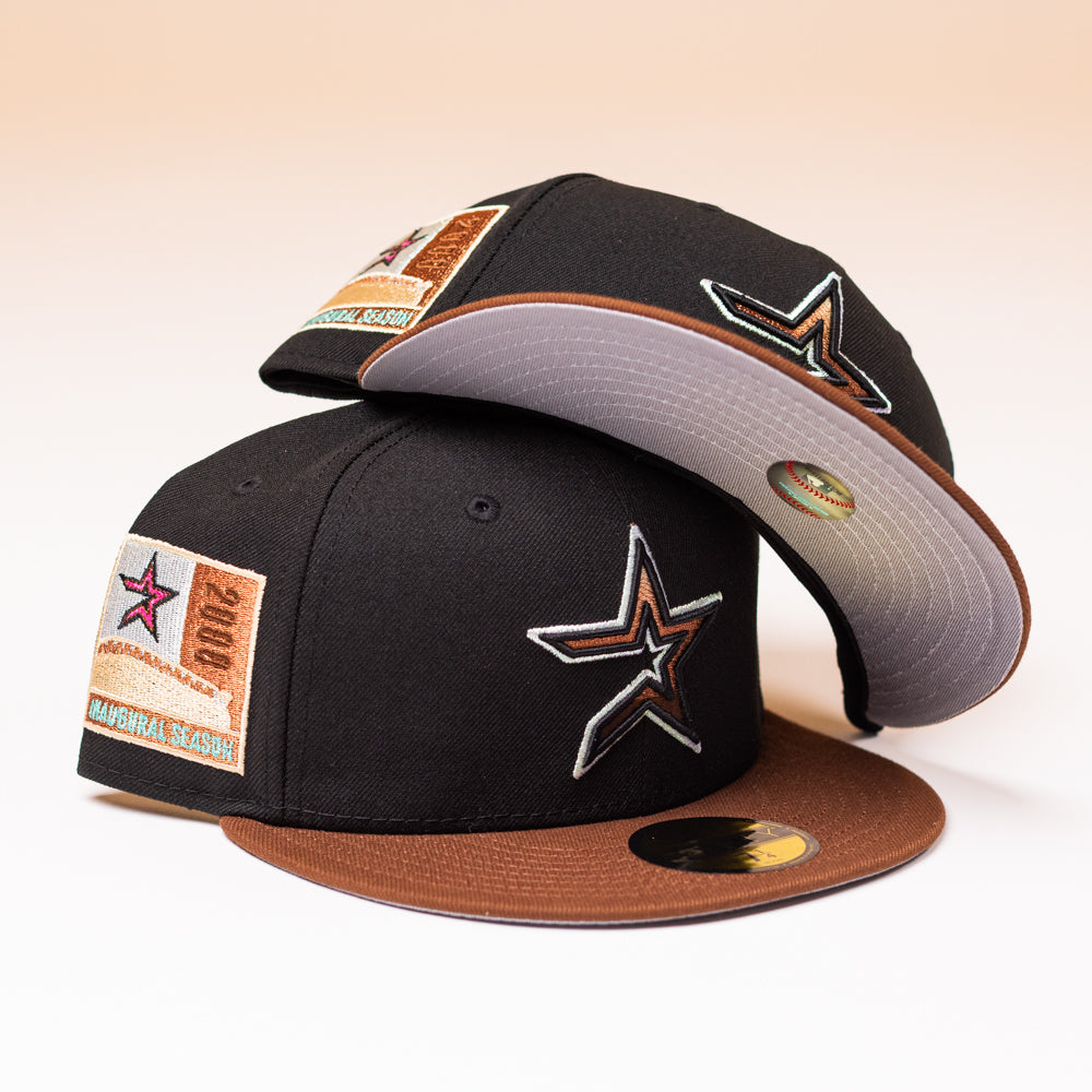 Two Espresso Martini Houston Astros New Era 5950 Fitted hats, featuring black and brown tones with star logos and decorative patches, are stacked together on a light background—a stylish nod to Alyyjadee’s unique collection.