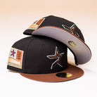 Two Espresso Martini Houston Astros New Era 5950 Fitted hats, featuring black and brown tones with star logos and decorative patches, are stacked together on a light background—a stylish nod to Alyyjadee’s unique collection.