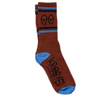The Eyes Dark Red Blue Black Krooked Socks feature a brown base with blue toes, heels, and stripes, two cartoon eyes near the top, and "KROOKED SKATEBOARDING" plus a smiling face on the sole. Playful dark red, blue, and black accents complete the design.