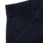 Close-up of the Eyes Twill Short Light Navy by Krooked Skateboards, showcasing subtle black two-eyes embroidery above the pocket seam.