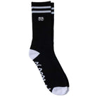 Introducing the Eyes EMB Black White Krooked Skateboards Socks—a classic crew sock in sleek black with two bold white stripes at the top. These socks showcase a small embroidered graphic of two faces, complemented by contrasting white toe and heel areas. Engineered as authentic skateboard socks, they feature signature Krooked Skateboards branding and striking white text along the bottom sole for an extra touch of style.