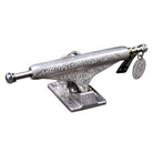 A FA x INDY 169 Hollow Polished Burnt Logo Stage 11 skateboard truck, featuring intricate engraved designs and two round metal tags attached to the axle, is shown isolated on a white background.