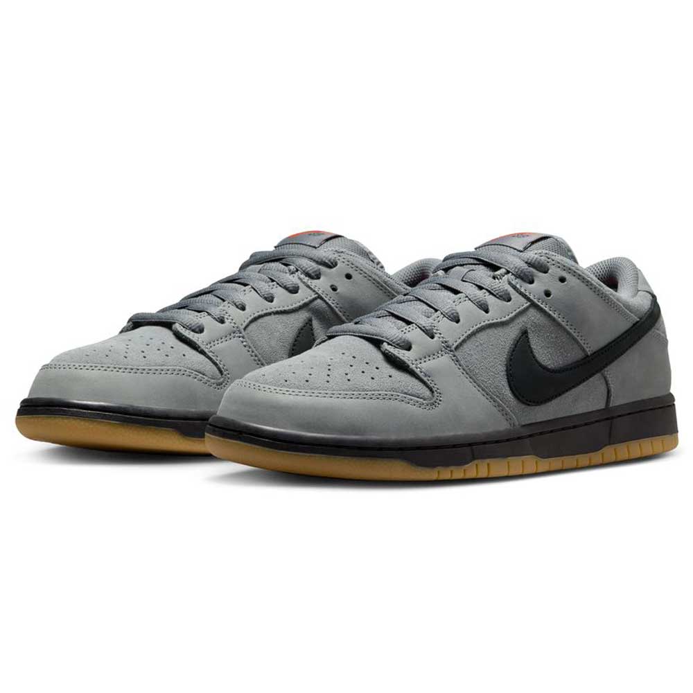 The FJ1674002 Cool Grey Black Nike SB Dunk Low Pro Suede Shoes feature gray suede, black swooshes and midsoles, and gum outsoles, shown from a front-side angle on a white background—ideal for classic sneaker fans.
