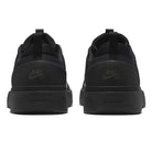The FQ1273-002 Black White Zoom Nyjah 4 Nike SB Skateboarding Shoes feature a black mesh upper for durability, NIKE SB branding on the heels, NYJAH embossed on the midsole, and are shown from the back.