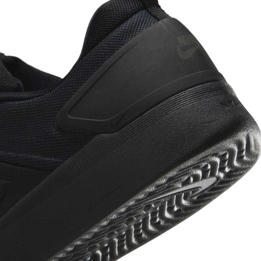 Close-up of the heel and sole of the black FQ1273002 Zoom Nyjah 4 Nike SB skate shoe, showing its textured HART outsole and part of the Nike logo embossed on the heel.