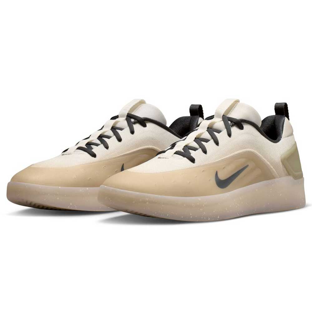 The FQ1273-200 Khaki White Zoom Nyjah 4 Nike SB Skateboarding Shoes feature a beige and white design with black laces, a black Swoosh, translucent soles, and a reinforced mesh upper for enhanced durability.