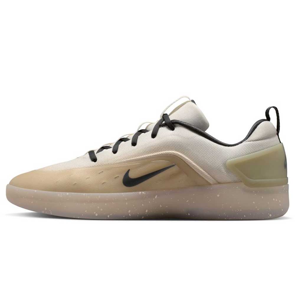 The FQ1273-200 Khaki White Zoom Nyjah 4 Nike SB Skateboarding Shoe features beige and light brown tones, black Swoosh and laces, a reinforced mesh upper, plus a semi-translucent speckled sole with Air Zoom cushioning, shown in side view.