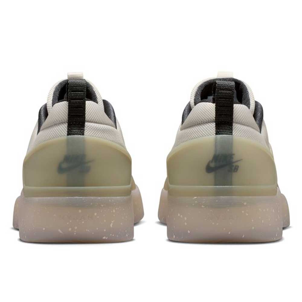 A rear view of the FQ1273200 Khaki White Zoom Nyjah 4 Nike SB Skateboarding Shoes shows beige sneakers with black accents, translucent soles, visible heel logos, and a reinforced mesh upper, side by side on a white background.