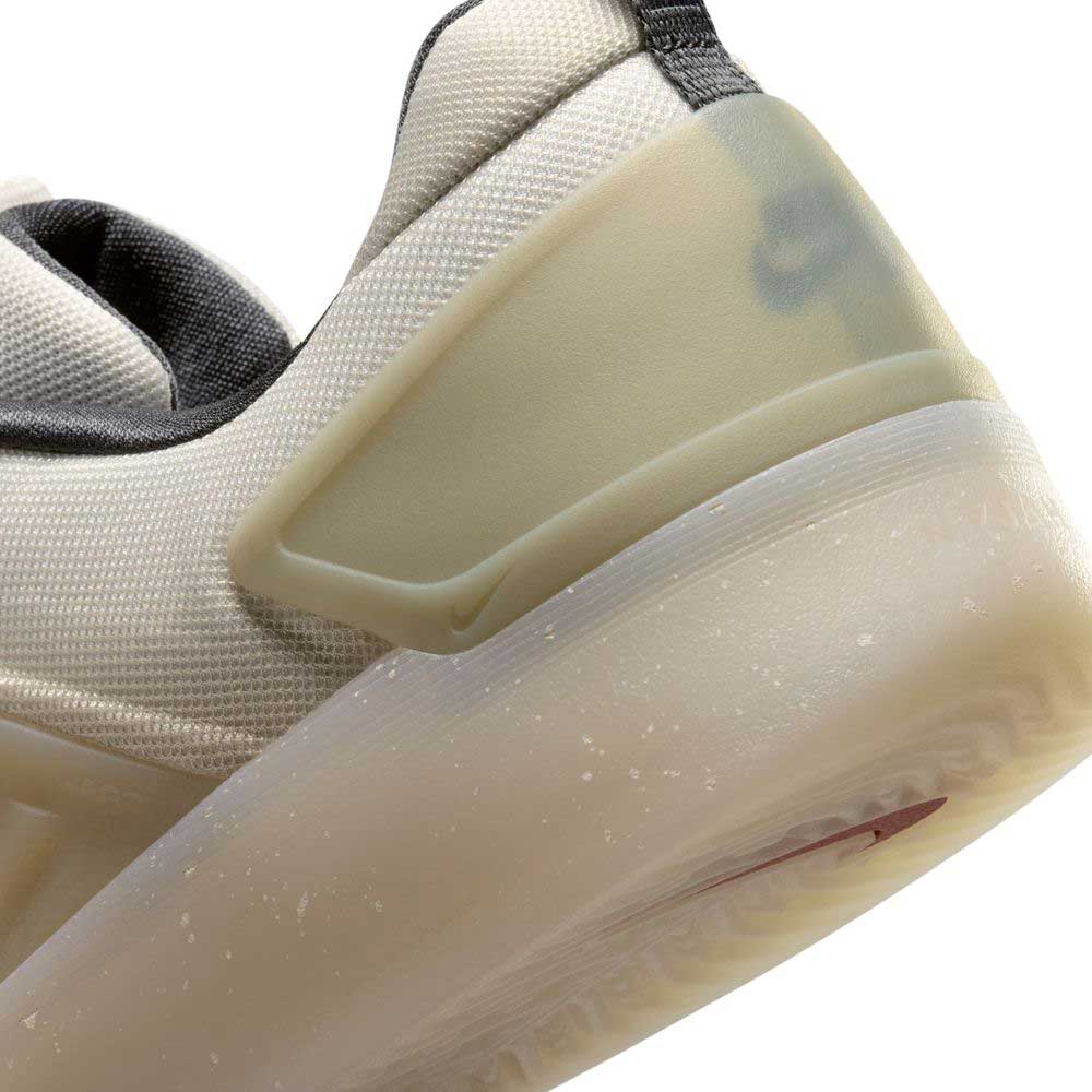 Close-up of the heel and sole of the FQ1273200 Khaki White Zoom Nyjah 4 Nike SB Skateboarding Shoes, featuring a semi-translucent HART outsole, reinforced mesh upper, detailed stitching, and subtle design elements.