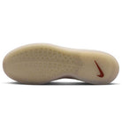 The image shows the outsole of the FQ1273200 Khaki White Zoom Nyjah 4 Nike SB Skateboarding Shoe, featuring a translucent HART outsole with a subtle wave-like tread pattern and a red Nike Swoosh logo near the heel.