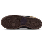 The image displays the brown rubber outsole of the Filbert Light Chocolate Black Burgundy Ash Dunk Low Pro HQ1625201 Nike SB Skateboarding Shoes, which features a classic basketball-inspired design reminiscent of the Nike Dunk Low, with a circular tread pattern at the forefoot and linear grooves at the heel and midfoot to provide traction.