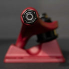 Close-up view of the Forged Hollow RTB FTR Burgundy Standard INDY 159 Stage 11 Trucks (Set of TWO), with focus on the axle nut and detailed metalwork. The blurred background highlights these lightweight skateboard trucks’ texture and shape.