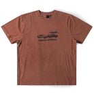 The Fork in the Road Former Tee Washed Bark is a brown, short-sleeve vintage T-shirt made from premium jersey cotton for comfort and style. It features a black screen-printed graphic of two cars crashing, with “FORMER” displayed above and “PENDING APPROVAL” below the image.