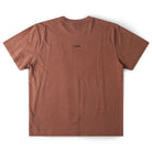 The Crux Overdye Former Tee in Washed Bark is a premium jersey cotton short-sleeve t-shirt, shown from the back and laid flat on a white background. The word “FORMER” appears in small black letters at the upper center.