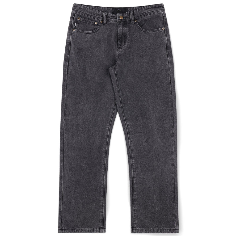 A pair of Crux Denim Pant Washed Black Former jeans, crafted from 100% cotton denim with a straight-leg silhouette, button and zip fly, front and back pockets, and copper rivet details, laid flat on a white background.