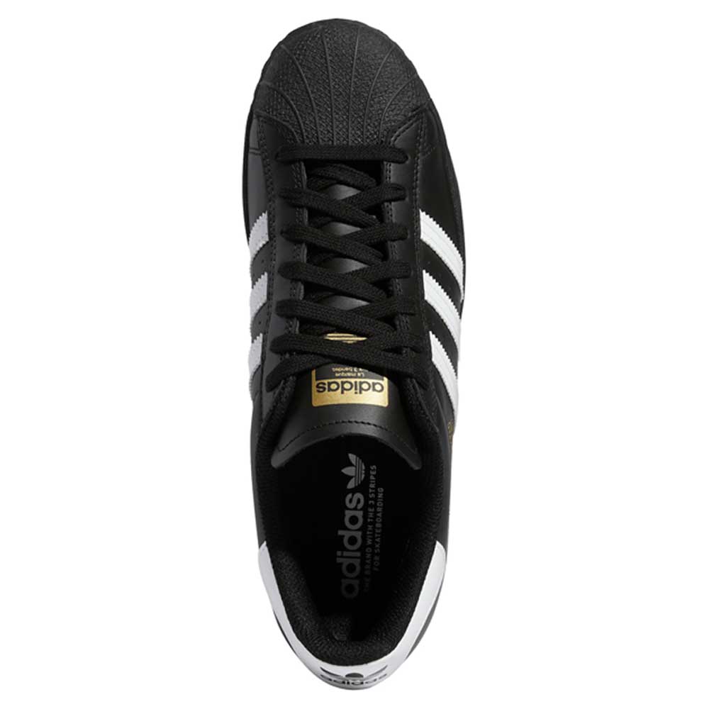 Top view of the GW6931 Black White Superstar ADV Adidas Skateboarding Leather Shoe—featuring classic white stripes, a white shell toe, black laces, and a gold adidas tongue label.