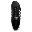 Top view of the GW6931 Black White Superstar ADV Adidas Skateboarding Leather Shoe—featuring classic white stripes, a white shell toe, black laces, and a gold adidas tongue label.