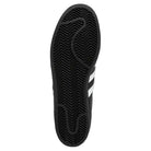 The image shows the black rubber sole of the GW6931 Black White Superstar ADV Adidas Skateboarding Leather Shoes, featuring a zigzag herringbone tread and a signature white stripe partially visible on the side.