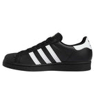 The GW6931 Black White Superstar ADV Adidas Skateboarding Leather Shoes feature a black low-top design with white stripes and heel tab, black laces, and a black rubber sole—classic style reimagined for skateboarding.
