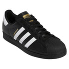The GW6931 Black White Superstar ADV Adidas Skateboarding Leather Shoes feature a shell toe, white side stripes, gold Superstar branding, gold adidas tongue logo, and a white heel accent—ideal for classic skate style fans.