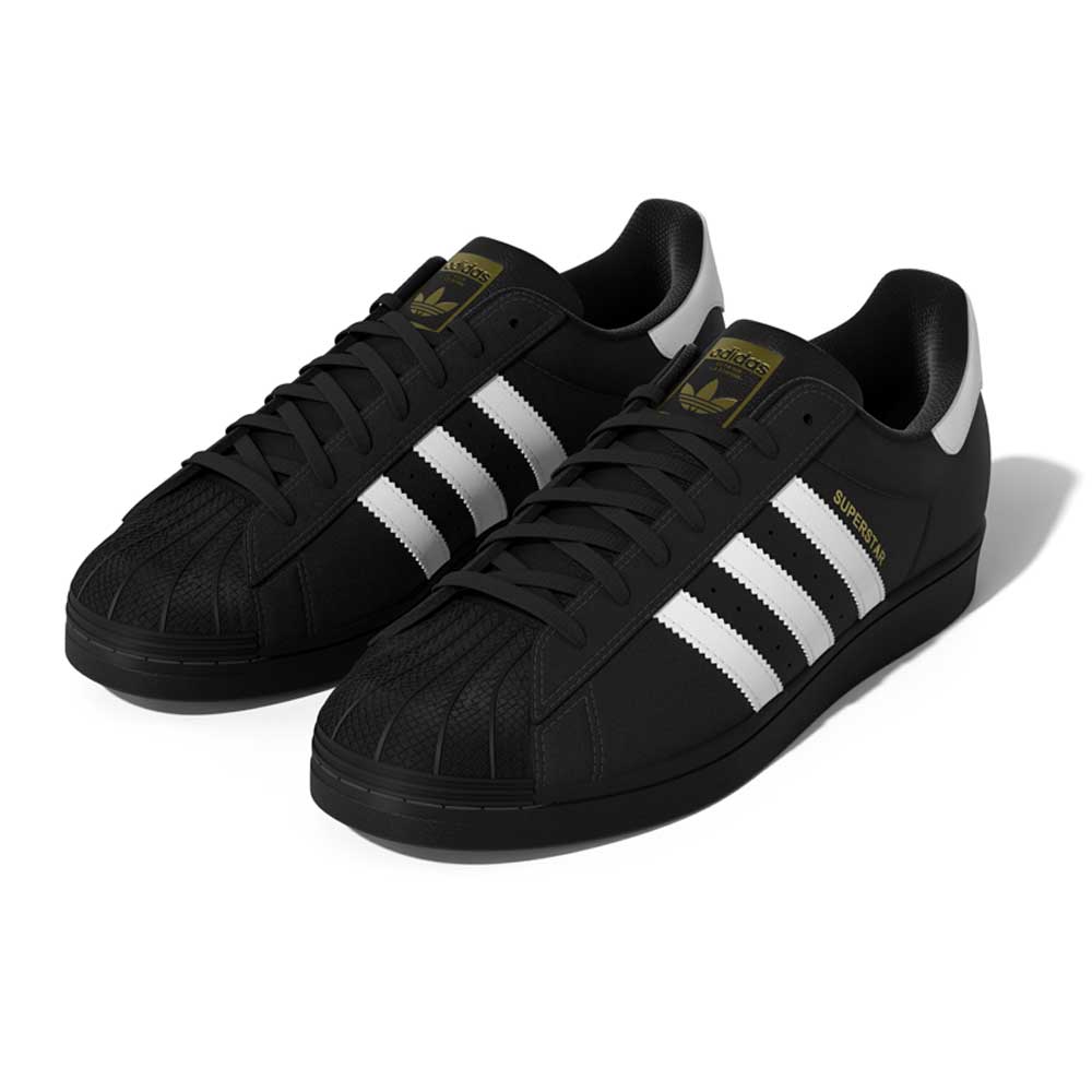 A front view of the GW6931 Black White Superstar ADV Adidas Skateboarding Leather Shoes, featuring black leather with white stripes, gold branding, black laces, a signature shell toe, and a white heel tab.