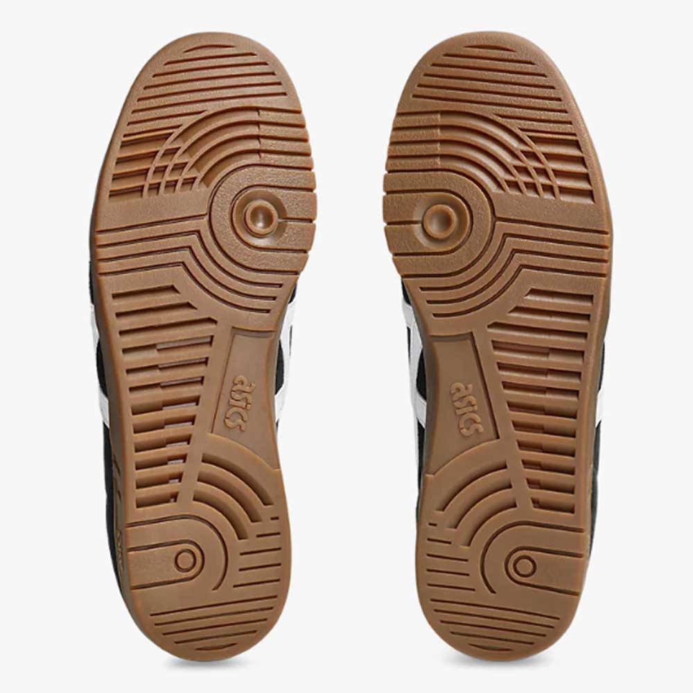 Two brown rubber soles from the ASICS Gel Vikka Pro Black Brown Suede Skateboarding Shoes (model 1201A486) feature a circular tread pattern and the ASICS logo at the center, optimized for enhanced board control, displayed side by side on a white background.