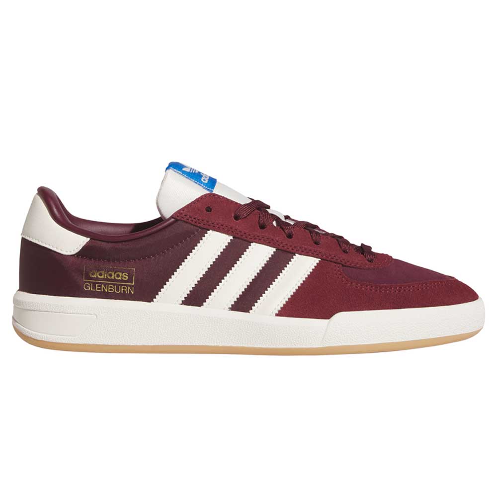 A Glenburn Burgundy White KJ5048 Adidas skateboarding shoe with a maroon upper, classic white stripes, a white heel, gold branding accents, and a white sole featuring a gum bottom is shown from the side on a plain background—ideal for anyone seeking timeless skateboarding shoe style and comfort.