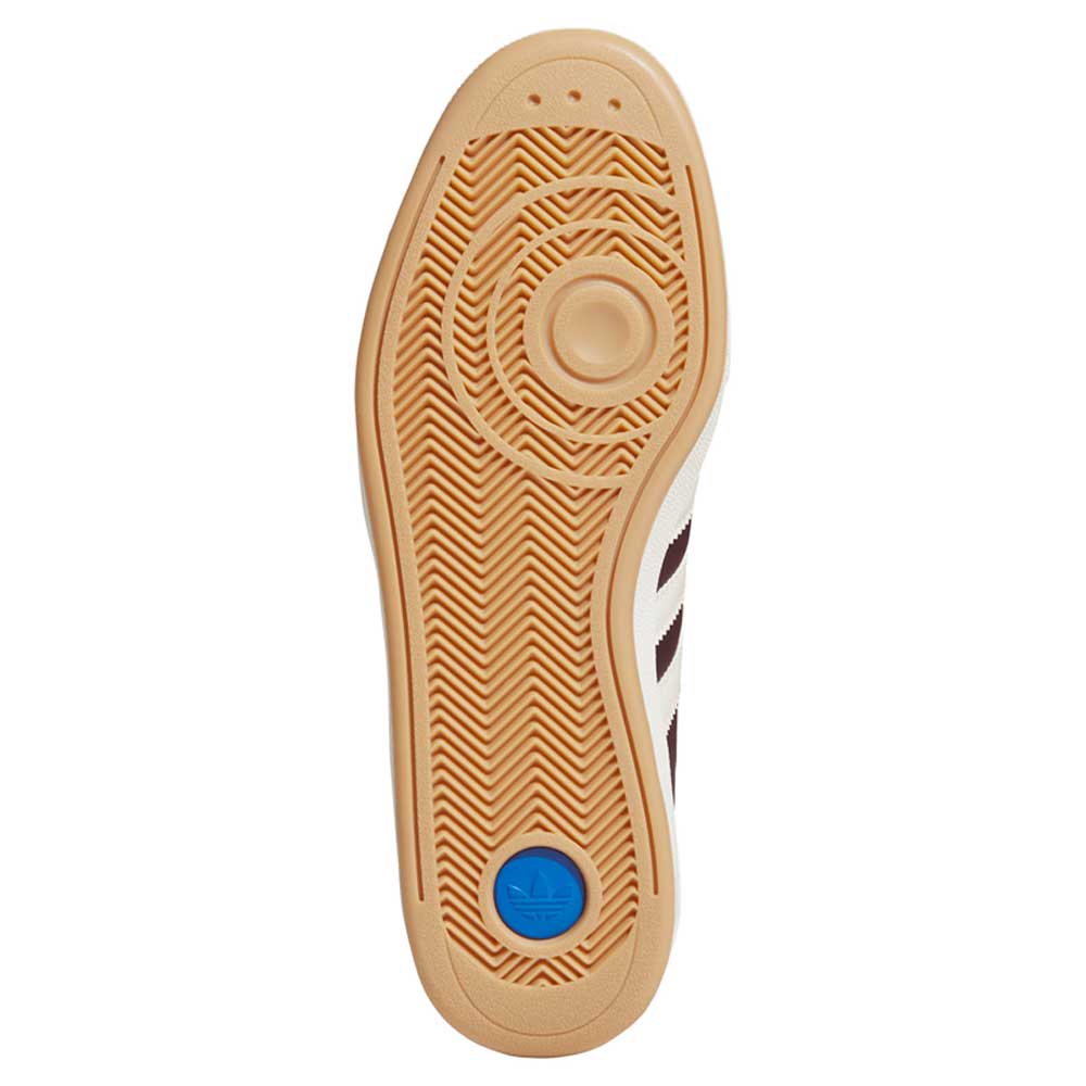 The sole of the Glenburn Burgundy White KJ5048 Adidas Skateboarding Shoes features a tan herringbone pattern, circular tread design, and a blue adidas logo near the heel—making it ideal for both Glenburn shoes and skateboarding footwear.